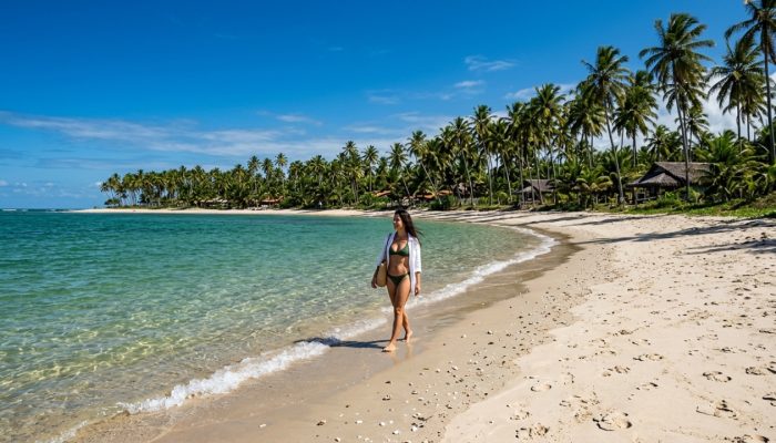 Woman_walking_on_beach_202605230147.jpg