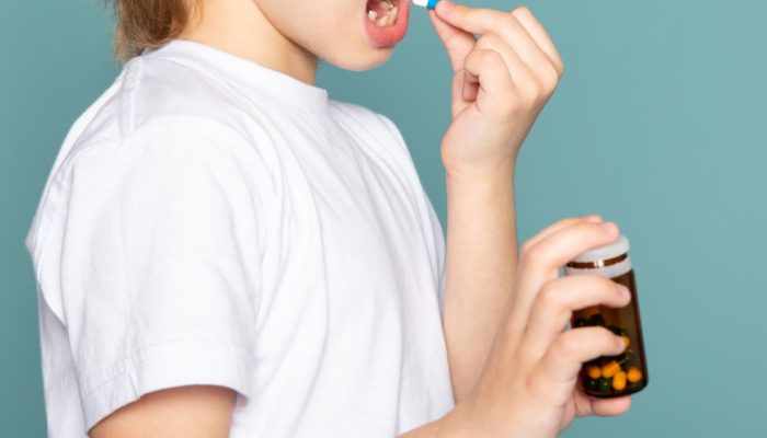 close-up-view-child-boy-blonde-sweet-adorable-cute-taking-pill-white-t-shirt-blue-desk.jpg close-up-view-child-boy-blonde-sweet-adorable-cute-taking-pill-white-t-shirt-blue-desk.jpg