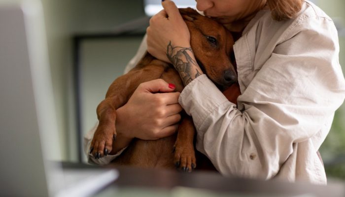 close-up-woman-hugging-her-pet-dog.jpg