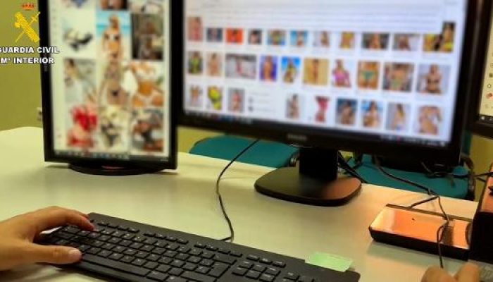 foto-disponibilizada-pela-policia-da-espanha-mostra-tela-de-computador-borrada-com-mulheres-nuas-um.jpeg