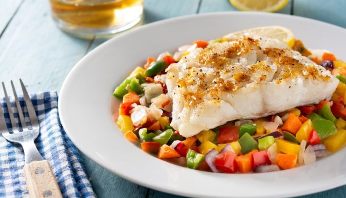 grilled-cod-with-vegetables-blue-wooden-table.jpg