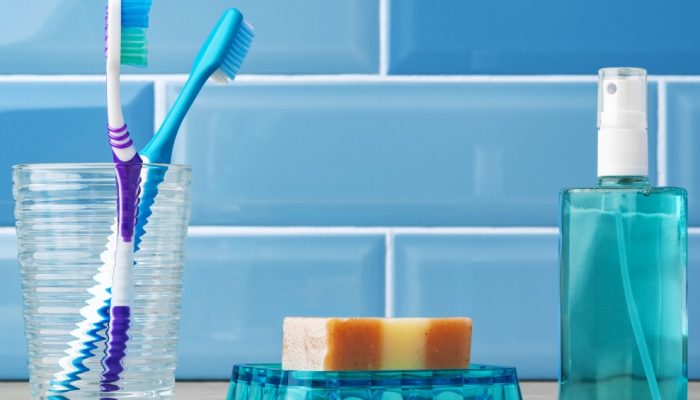 toothbrushes-glass-blue-bathroom.jpg