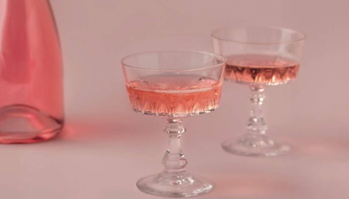 two-crystal-glasses-bottle-rose-sparkling-wine-champagne-pastel-pink-background_edit-2.jpg.jpg